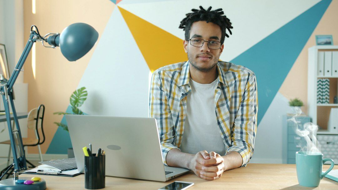 writer at desk with lamp